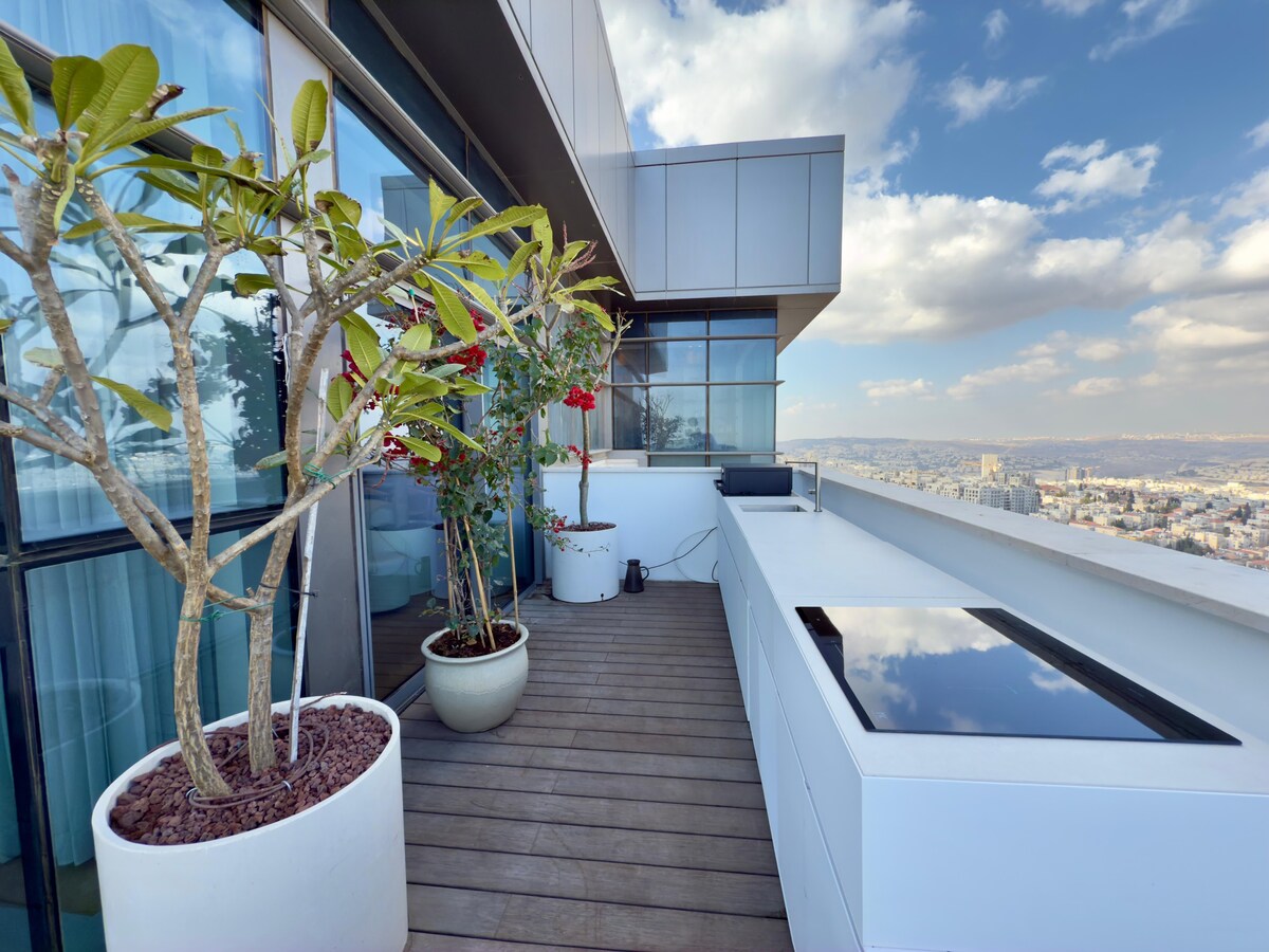 The outdoor kitchen, along the balcony